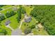 Expansive view of this property with a long driveway, outbuildings, and a large, well-manicured yard at 5328 Trackway Dr, Knightdale, NC 27545