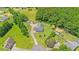 A bird's-eye view showcases this home with lush landscaping and convenient outbuildings on the property at 5328 Trackway Dr, Knightdale, NC 27545