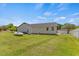 Expansive backyard featuring a lush lawn and exterior view of the home at 5328 Trackway Dr, Knightdale, NC 27545