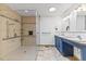 Bathroom showcases a spacious shower and a blue double sink vanity at 5328 Trackway Dr, Knightdale, NC 27545
