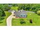Charming home featuring a welcoming front porch and lovely landscaping at 5328 Trackway Dr, Knightdale, NC 27545