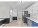 Bright kitchen with stainless appliances and access to another room at 5328 Trackway Dr, Knightdale, NC 27545