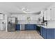 Spacious kitchen with stainless appliances, white cabinets and tile floors at 5328 Trackway Dr, Knightdale, NC 27545