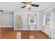 Bright living area with hardwood floors, ceiling fans, and sliding door, ready for customization at 5328 Trackway Dr, Knightdale, NC 27545