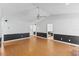 Bright living room with fresh paint, wood floors, ceiling fan, and neutral decor at 5328 Trackway Dr, Knightdale, NC 27545