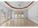 Bright living room features large windows and a ceiling fan at 5328 Trackway Dr, Knightdale, NC 27545