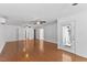 Open living area with hardwood floors, ceiling fans, sliding door, and natural light at 5328 Trackway Dr, Knightdale, NC 27545