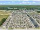 Aerial view of a large townhome community with a pond at 5430 Crescent Square St, Raleigh, NC 27616