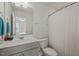 Bathroom featuring a single sink vanity, a toilet, and a shower/tub with a curtain at 5430 Crescent Square St, Raleigh, NC 27616