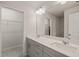 Bathroom features a double sink vanity with a large mirror and a walk in closet at 5430 Crescent Square St, Raleigh, NC 27616