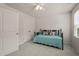 Comfortable bedroom featuring a daybed, carpeted floor, and closet at 5430 Crescent Square St, Raleigh, NC 27616