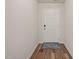 Bright foyer featuring wood-look flooring and a neutral color palette at 5430 Crescent Square St, Raleigh, NC 27616