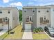 Townhome exterior with wooden balcony above the garage at 5430 Crescent Square St, Raleigh, NC 27616