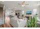 Open floorplan with stairs, kitchen, living, and dining area. Television is mounted to the wall at 5430 Crescent Square St, Raleigh, NC 27616