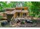The backyard features a wooden deck, stairs, and an outdoor cooking area at 60 Stoneridge Rd, Durham, NC 27705