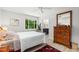 Light and airy bedroom with natural light, ceiling fan, and vanity with sink at 60 Stoneridge Rd, Durham, NC 27705