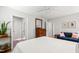 Bedroom features light wood floors, ceiling fan, closet, and comfortable furnishings at 60 Stoneridge Rd, Durham, NC 27705
