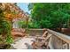 Spacious wooden deck with comfortable seating, a pergola, and a lush green backdrop at 60 Stoneridge Rd, Durham, NC 27705