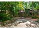 Charming two-story townhouse with natural landscaping and a private driveway nestled among mature trees at 60 Stoneridge Rd, Durham, NC 27705