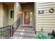 Close up of the front door and steps of a home featuring a red door and a black railing at 60 Stoneridge Rd, Durham, NC 27705