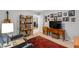 Cozy living room with shelves, television, and comfortable seating arrangement at 60 Stoneridge Rd, Durham, NC 27705