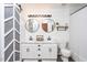 Chic bathroom features a double sink vanity, shiplap walls and modern fixtures at 610 Walnut Woods Dr, Morrisville, NC 27560
