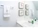 Bright bathroom features a single sink vanity and decorative bird artwork for a cheerful touch at 610 Walnut Woods Dr, Morrisville, NC 27560