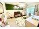 Well-appointed Bedroom featuring a dark wood crib, glider, and window seat in bright interior at 610 Walnut Woods Dr, Morrisville, NC 27560