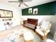 Charming Bedroom featuring a dark wood crib, glider, and a cozy, inviting atmosphere at 610 Walnut Woods Dr, Morrisville, NC 27560