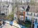 Charming brick townhome features a bay window and inviting entrance at 610 Walnut Woods Dr, Morrisville, NC 27560