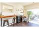 Stylish living area with a rustic bar, complemented by an outdoor deck access at 610 Walnut Woods Dr, Morrisville, NC 27560