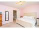 Spacious main bedroom showcasing a well-lit bed and convenient access to the bathroom at 610 Walnut Woods Dr, Morrisville, NC 27560