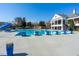 Community pool with a diving board and a clubhouse in the background at 610 Walnut Woods Dr, Morrisville, NC 27560