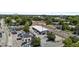 Aerial perspective of railroad and loading station for downtown community; surrounded by a mix of buildings and greenery at 622 Sunset Ave, Apex, NC 27502