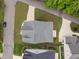 Bird's eye view of a light blue house with a well-maintained lawn at 622 Sunset Ave, Apex, NC 27502