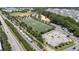 Overhead view featuring a nearby sports complex, train, and skatepark, with trees providing a blend of recreational amenities at 622 Sunset Ave, Apex, NC 27502
