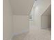 Walk-in attic showing finished flooring at 622 Sunset Ave, Apex, NC 27502