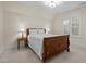 Well-lit bedroom with a large bed, side tables with lamps, and window at 622 Sunset Ave, Apex, NC 27502