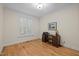 Bedroom featuring a desk, chair, and oak hardwood floors providing ample space at 622 Sunset Ave, Apex, NC 27502