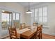 Bright dining area with sliding doors, plantation shutters, and backyard views at 622 Sunset Ave, Apex, NC 27502