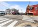 Street-level shot of downtown with sidewalks, crosswalks, traffic lights, and red brick buildings exuding old-town charm at 622 Sunset Ave, Apex, NC 27502