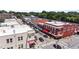 Birds eye view of downtown buildings with colorful awnings, sidewalks, and busy street, showcasing the community's charm at 622 Sunset Ave, Apex, NC 27502