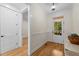 Bright entryway with hardwood floors, leading to additional rooms and back entry door at 622 Sunset Ave, Apex, NC 27502