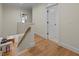 Hallway showing the transition from staircase to carpeted bedroom entryway at 622 Sunset Ave, Apex, NC 27502