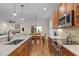 Spacious kitchen with granite counters, stainless appliances, and seamless flow into the dining area at 622 Sunset Ave, Apex, NC 27502