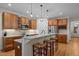 Well-lit kitchen with modern cabinets, stainless appliances, granite countertops, and a breakfast bar at 622 Sunset Ave, Apex, NC 27502