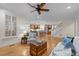 Open-concept living room with hardwood floors, flowing into the kitchen and dining area at 622 Sunset Ave, Apex, NC 27502