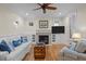 Cozy living room featuring a fireplace, hardwood floors, and stylish decor at 622 Sunset Ave, Apex, NC 27502