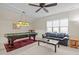 Recreation room featuring a pool table, ceiling fan, and sofa at 622 Sunset Ave, Apex, NC 27502