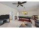 Recreation room with a pool table, fan, sofa, and tv at 622 Sunset Ave, Apex, NC 27502